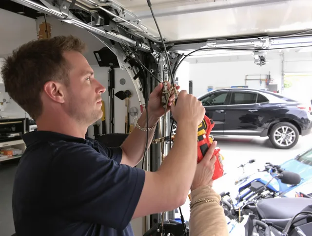 Hamden Garage Door Repair safety certified technician performing cable replacement in Hamden