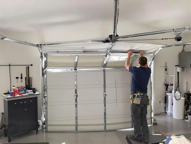 Hamden Garage Door Repair specialist performing precise section replacement on Hamden garage door